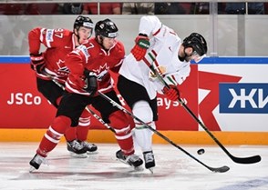 ST. PETERSBURG, RUSSIA - MAY 8: Canada's Connor McDavid #97 and Ryan Murray #27 battle for the puck with Hungary's Janos Vas #21 during preliminary round action at the 2016 IIHF Ice Hockey Championship. (Photo by Minas Panagiotakis/HHOF-IIHF Images)

