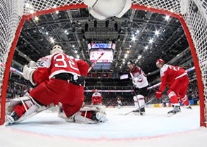 MOSCOW, RUSSIA - MAY 13: Denmark's Sebastian Dahm #32 can't make the save on the shot by Latvia's Andris Dzerins #25 (not shown) while Oliver Lauridsen #25 and Kaspars Daugavins #16 look on during preliminary round action at the 2016 IIHF Ice Hockey World Championship. (Photo by Andre Ringuette/HHOF-IIHF Images)

