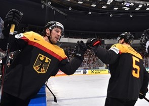 ST. PETERSBURG, RUSSIA - MAY 15: Germany's Patrick Reimer #37 high fives Korbinian Holzer #5 after a first period goal during preliminary round action at the 2016 IIHF Ice Hockey World Championship. (Photo by Minas Panagiotakis/HHOF-IIHF Images)

