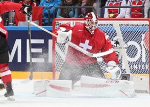 MOSCOW, RUSSIA - MAY 15: Switzerland's Reto Berra #20 makes the save on this play during preliminary round action against Sweden at the 2016 IIHF Ice Hockey World Championship. (Photo by Andre Ringuette/HHOF-IIHF Images)

