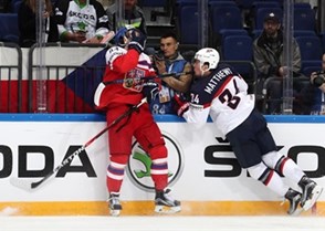 MOSCOW, RUSSIA - MAY 19: The Czech Republic's Tomas Kundratek #84 take a hit along the boards from USA's Auston Matthews #34 during quarterfinal round action at the 2016 IIHF Ice Hockey World Championship. (Photo by Andre Ringuette/HHOF-IIHF Images)

